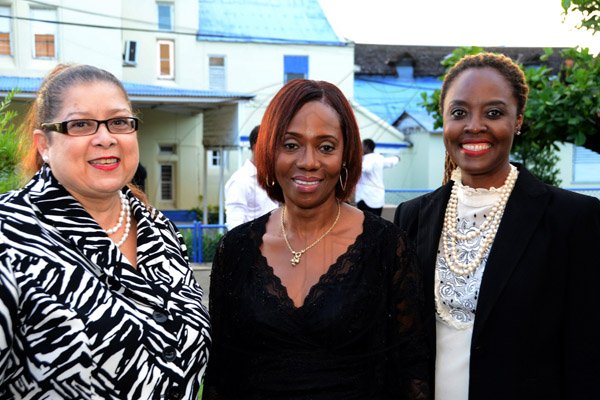 Winston Sill/Freelance Photographer
The Council of Legal Education, Norman Manley Law School Ceremony for The Presentation of Graduates, held at the Karl Hendrickson Auditorium, Jamaica College, Old Hope Road on Saturday night September 27, 2014. Here are Miriam Samaru (left), Principal, Hugh Wooding Law School; Carol Aina, Principal, Norman Manley Law School; and Tonya Bastian Galanis (right), Principal, Eugene Dupuch Law School.