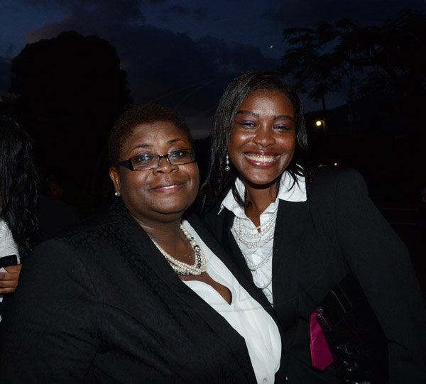 Winston Sill/Freelance Photographer
The Council of Legal Education, Norman Manley Law School Ceremony for The Presentation of Graduates, held at the Karl Hendrickson Auditorium, Jamaica College, Old Hope Road on Saturday night September 27, 2014. Here are Shernett Robinson (left), and a friend.