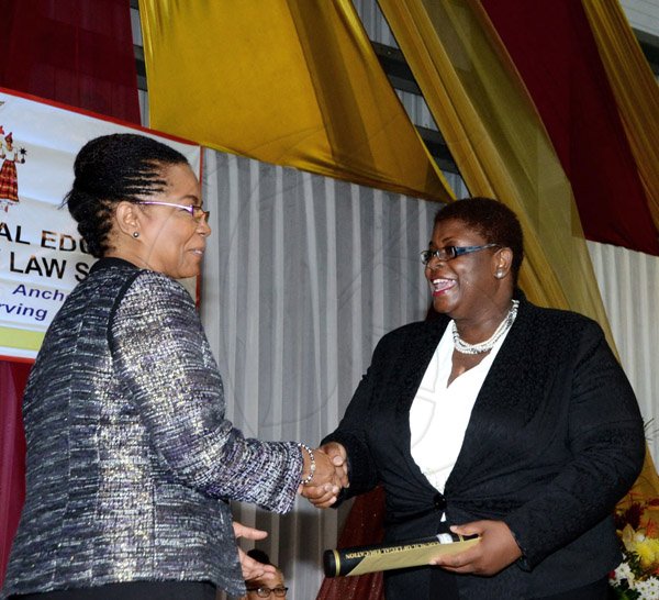 Winston Sill/Freelance Photographer
The Council of Legal Education, Norman Manley Law School Ceremony for The Presentation of Graduates, held at the Karl Hendrickson Auditorium, Jamaica College, Old Hope Road on Saturday night September 27, 2014. Here are Jacqueline Samuels-Brown (left) Chairman, Council of Legal Education; and Shernett Robinson (right).