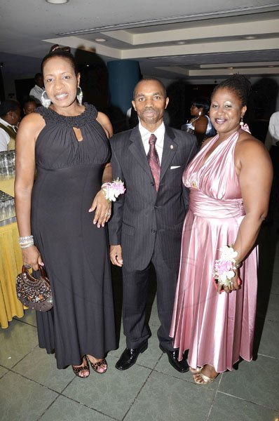 Rudolph Brown/Photographer
Rocky Meade is a happy man as he is sandwiched by Andrea Francis (left) and Roxanna Harriot.

*************************************************************** at the Lay Magistrates Association of Jamaica (Kingston Chapter) Annual Banquet at the Wyndam Kingston Hotel on Saturday, September 24-2011