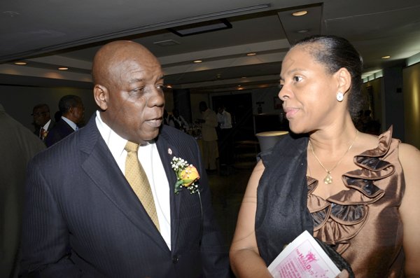 Rudolph Brown/Photographer
Dawn Satterwaite Allen chat with her husband Terrence Allen at the Lay Magistrates Association of Jamaica (Kingston Chapter) Annual Banquet at the Wyndam Kingston Hotel on Saturday, September 24-2011