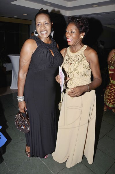 Rudolph Brown/Photographer
Andrea Francis (left) and Dr Paulette Francis McGregor sport contrasting gowns.

************************************************************************The Lay Magistrates Association of Jamaica (Kingston Chapter) Annual Banquet at the Wyndam Kingston Hotel on Saturday, September 24-2011
