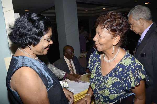 Rudolph Brown/Photographer
Norma Brown, (right) and Carmen Bromley are caught in a friendly discourse.

*************************************************************************************at the Lay Magistrates Association of Jamaica (Kingston Chapter) Annual Banquet at the Wyndam Kingston Hotel on Saturday, September 24-2011