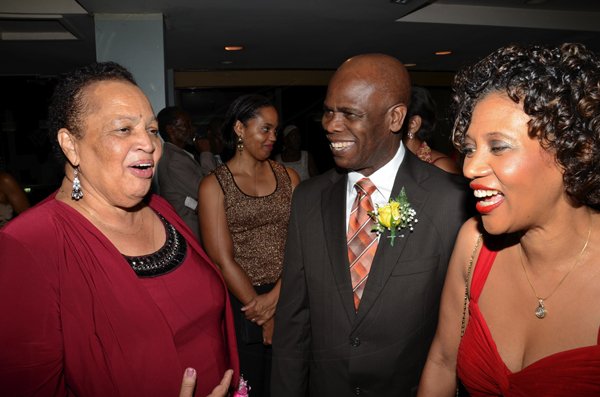 Rudolph Brown/Photographer
Dr Barbara Gloudon, (left) and her daugther Anya Gloudon (second left) chat with Steadman Fuller, Custos of Kingston and his wife Sonia  at the Lay Magistrates Association of Jamaica (Kingston Chapter) Annual Banquet at the Wyndam Kingston Hotel on Saturday, September 24-2011