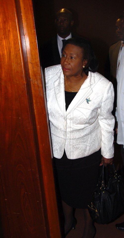 Norman Grindley/Chief Photographer
Dorothy Lightbourne, the minister of justice and attorney general takes a glimpse inside the Manatt-Dudus commission of enquiry at the Jamaica Conference Centre, downtown Kingston. Lightbourne arrived at the conference centre 9:25 am to  testify after Lieutenant Colonel Patrick Cole today March 3, 2011.