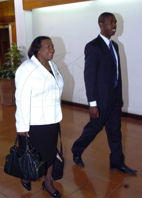 Norman Grindley/Chief Photographer
Norman Grindley/Chief Photographer
Dorothy Lightbourne, (left) the minister of justice and attorney general makes her way  into the Manatt-Dudus commission of enquiry at the Jamaica Conference Centre, downtown Kingston with Warren Newby, state minister of information, youth, sports and culture. Lightbourne arrived at conference centre 9:25 am and will be testify after Lieutenant Colonel Patrick Cole today March 3, 2011.
