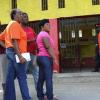 Ricardo Makyn/Staff Photographer
Voters wait patiently outside    the Nanny Ville Community Centre on Election Day
