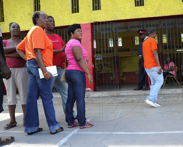 Ricardo Makyn/Staff Photographer
Voters wait patiently outside    the Nanny Ville Community Centre on Election Day