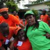 Ricardo Makyn/Staff Photographer
PNP and JLP Supporters in the August Town Community on Election Day