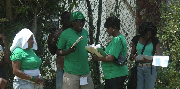 Photo by Adrian Frater

JLP party workers in Hanover relaxing under the shaed of a tree as they passed time with very little to do.