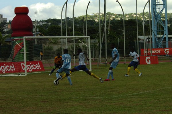 DSC_0011..............At full stretch, this Hydel player tries to bring the ball under control in his schools first math of the Manning Cup against STGC.