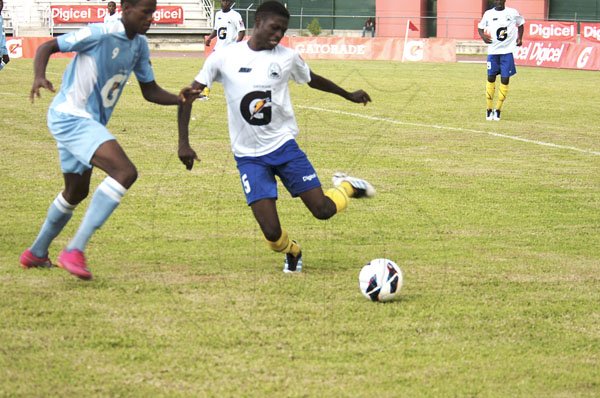 DSC_0027.........Patrick Okonkwo (left) scored STGC first goal of the 2012 ISSA Manning Cup, as the defending champions were held to a 1-1 draw with Hydel. Romario Jones gave STGC a share of the points with a stoppage time goal.