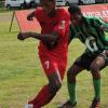 Ian Allen/Photographer Calabar Gequan Pringle (left) and Bridgeport Rayon Swire tussle for possession during their ISSA/Gatorade/Digicel Manning Cup clash at Red Hills Road yesterday. The match ended 1-1.