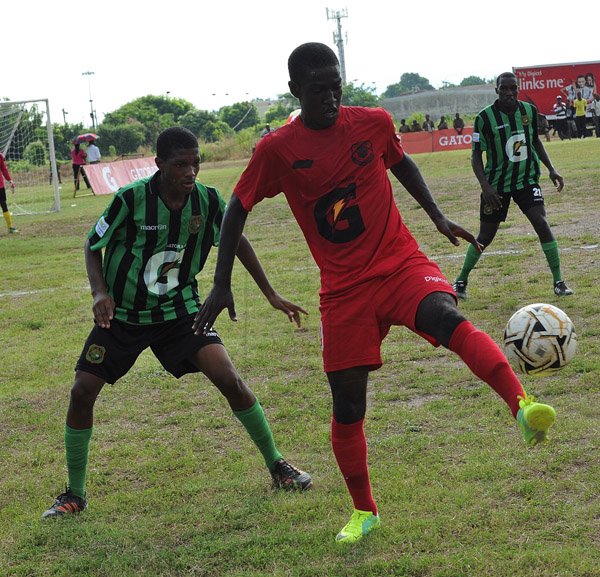 Ian Allen/Photographer Bridgeport High's Neiko Williams (right) shields the ball from Tevin Richards of Calabar High during yesterday's ISSA/Gatorade/Digicel Group G Manning Cup match at Calabar. The game ended 0-0.