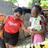 Rudolph Brown/PhotographerJennifer McDonald, (centre) Mother and grandmother mourning the death of family after gunmen shoot up seven killing five including three children and set their home ablaze at Africa settlement in March Pen Community in Spanish Town on Sunday, October 9
