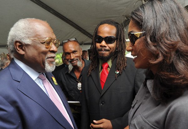 Rudolph Brown/Photographer
Julius Garvey, (left) son of the Marcus Mosiah Garvey chat with from right Lisa Hanna, Minister of Youth and Culture, Steven Golding, President of UNIA Jamaica and Clement Deslandes of UNIA at the Floral Tribute commemorating the 125th Anniversary of the birth The Rt. Excellent Marcus Mosiah Garvey, Jamaica National Hero at the National Heroes Park in Kingston on Friday, August 17-2012