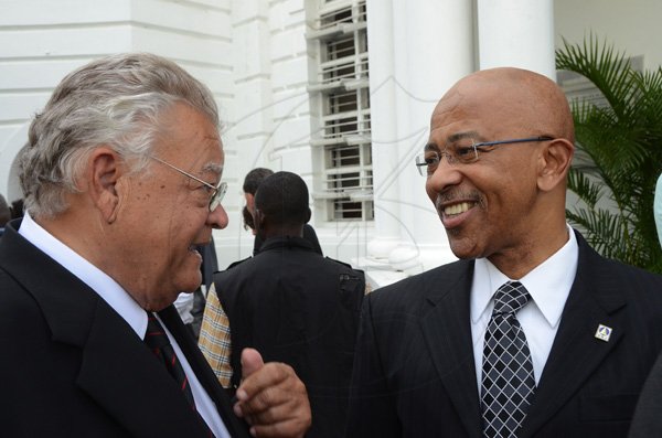 Rudolph Brown/Photographer
Karl Samuda, (left) chat with Milverton Reynolds at the service of thanksgiving for the Mayer Michael Matalon at the Synagogue on duke Street in Kingston on Monday, February 6-2012