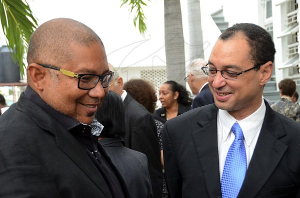 Rudolph Brown/Photographer
Don Wehby, (right) chat with Chis Berry at the service of thanksgiving for the Mayer Michael Matalon at the Synagogue on duke Street in Kingston on Monday, February 6-2012