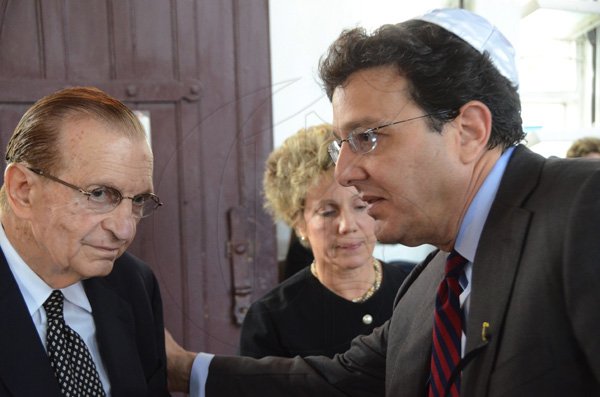 Rudolph Brown/Photographer
Joseph M. Matalon greets Edward Seaga and his wife Carla Seaga  at his father service of thanksgiving for the Mayer Michael Matalon at the Synagogue on duke Street in Kingston on Monday, February 6-2012