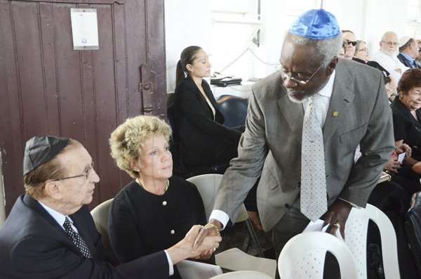 Rudolph Brown/Photographer
P.J Patterson greets Edward Seaga and his wife Carla Seaga at the service of thanksgiving for the Mayer Michael Matalon at the Synagogue on duke Street in Kingston on Monday, February 6-2012