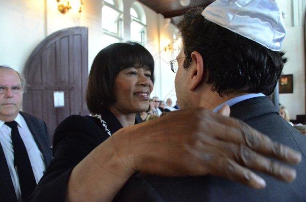 Rudolph Brown/Photographer
Prime Minister Portia Simpson Miller greets Joseph M. Matalon at his father service of thanksgiving for the Mayer Michael Matalon at the Synagogue on duke Street in Kingston on Monday, February 6-2012