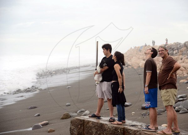 Gladstone Taylor/ Photographerscores of persons flocked to the Palisadoes strip on Monday september 3, 2016 to view the large waves crashing along the shoreline.
