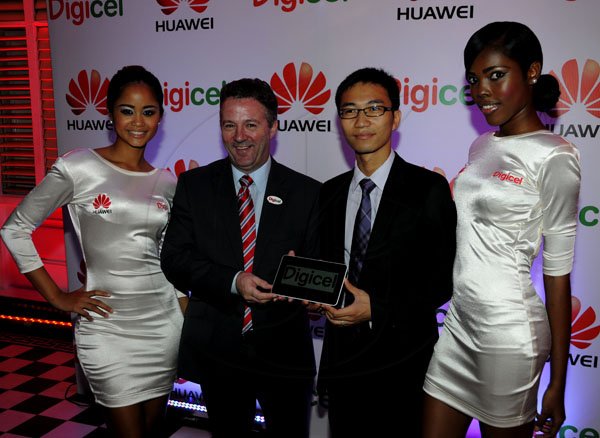 Winston Sill / Freelance Photographer
Digicel and Huawei presents the launch of the new Huawei Media Pad, held at Devon House, Hope Road on Monday night November 12, 2012. Here are Joanna Sadler (left); Andy Thorburn (second left), CEO, Digicel; Ricardo Xiao Hua (second right), General Manager, Huawei Technologies Ja. Ltd.; and Chanique James (right).