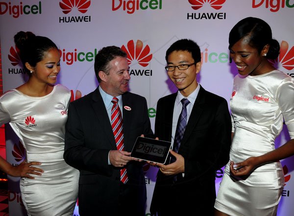 Winston Sill / Freelance Photographer
Digicel and Huawei presents the launch of the new Huawei Media Pad, held at Devon House, Hope Road on Monday night November 12, 2012. Here are Joanne Sadler (left); Andy Thorburn (secon left), CEO, Digicel; Ricardo Xiao Hua (second right), General Manager, Huawei Technologies Ja. Ltd.; and Chanique James (right).