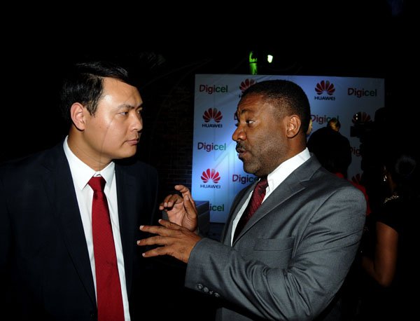 Winston Sill / Freelance Photographer
Digicel and Huawei presents the launch of the new Huawei Media Pad, held at Devon House, Hope Road on Monday night November 12, 2012. Here are Vincent Wen (left), Sales Director, Central America and the Caribbean, Huawei; and Minister Phillip Paulwell (right).