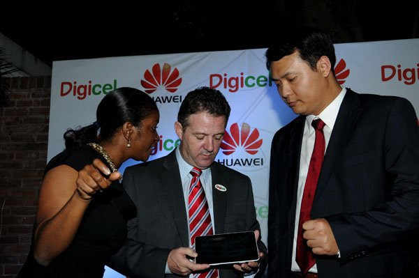 Winston Sill / Freelance Photographer
Digicel and Huawei presents the launch of the new Huawei Media Pad, held at Devon House, Hope Road on Monday night November 12, 2012. Here are Jackie Burrell-Clarke (left); Andy Thorburn (centre), Digicel CEO,; and Vincent Wen (right), Sales Director, Central America and the Caribbean, Huawei.