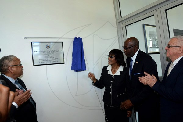 Winston Sill/Freelance Photographer
Prime Minister Portia Simpson-Miller opens UWI's   Faculty of  Medical Sciences' Teaching and Research Complex, and Launch of The UWI, Mona Dental Programme, held at West Road, UWI  Mona Campus, on Wednesday February 4 , 2015. Here are Prof. Archibald McDonald (left), Principal, UWI, Mona Campus; Prime Minister Portia Simpson-Miller (third right); Dr. Fenton Ferduson (second right), Minister of Health; and Ronald Thwaites (right), Minister of Education.