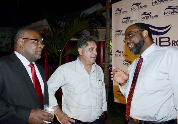 Winston Sill/Freelance Photographer

Sharing a casual convo at the mingle are businessmen (from left) Walter Scott, Gassan Azan and Earl Jarrett.