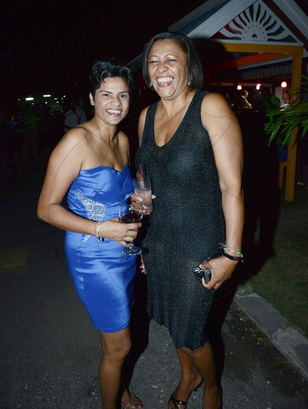 Winston Sill/Freelance Photographer

Marlene Sewell (left)  shares a laugh with Winsome Hall (right)  at the Maritime General Insurance Brokers corporate lyme and mingle.