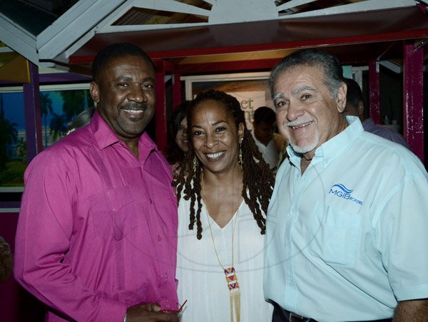 Winston Sill/Freelance Photographer
Energy Minister Phillip Paulwell (right)  and  Errol Zaidie (left) flanks the lovely  Yolande Rattary-Wright.