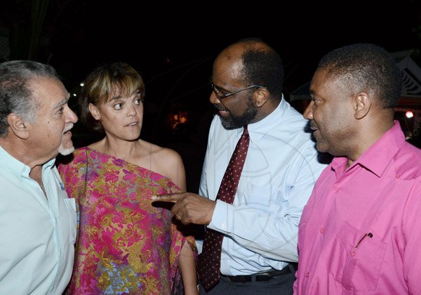 Winston Sill/Freelance Photographer

Nikki Barber (second left) sure;y didnt mind being the only lady in the group as she exchanges a few words with  Errol Ziadie (left); ); Earl Jarrett (second right); and Minister Phillip Paulwell (right).