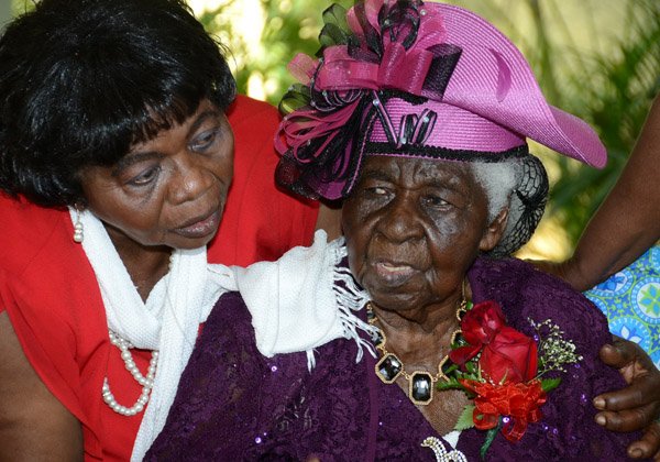 Winston Sill/Freelance Photographer
Centennial Birthday Celebrations for Mildred Adora James, held ay Polyanna Caterers, Stanton Terraceon Sunday June 28, 2015. Here are Agatha Mitchell (left) Church Sister:  and Mildred AdoreJames (right).