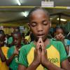 Ian Allen/Photographer
Students at Mount Olivet Primary School in Manchester having devotion during the Opening of their Word Wall and Commissioning of Reading Monitors at the school on Friday, 27, 2015.