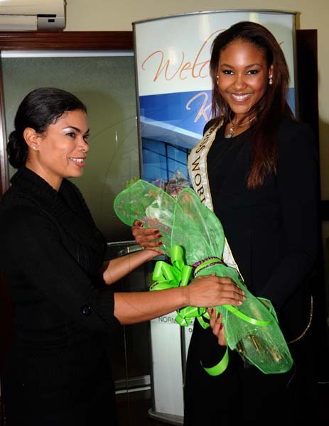 Winston Sill/Freelance Photographer
Miss Jamaica World 2013 and Miss World Caribbean Gina Hargitay return from Miss World Contest, at Norman Manley International Airport on Monday October 14, 2013. Here are Laura Butler (left); and Gina Hargitay (right).