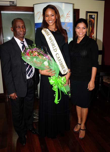 Winston Sill/Freelance Photographer
Miss Jamaica World 2013 and Miss World Caribbean Gina Hargitay return from Miss World Contest, at Norman Manley International Airport on Monday October 14, 2013. Here are Sidney Bartley (left), of the Ministry of Youth and Culture; Gina Hargitay (centre); and Laura Butler (right).