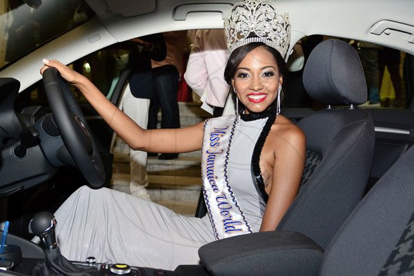 Miss Jamaica World 2014, Laurie-Ann Chin checks out her Audi A3 that she will drive for a year, courtesy of ATL Motors at the Montego Bay Convention Centre on Saturday night.