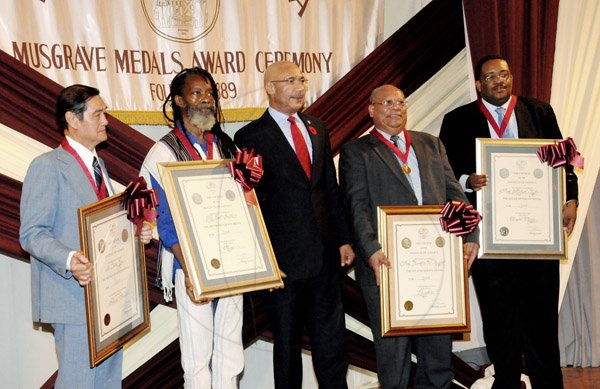 Winston Sill/Freelance Photographer
From left: Dr Trevor Yee), Bronze awardee; Earl 'Chinna' Smith, Silver; Governor General Sir Patrick Allen; Professor Franklin Knight, Gold; and Professor Michael Taylor, Silver, proudly show their citations during The Institute of Jamaica's Musgrave Medals Award Ceremony at the institute's complex on East Street yesterday.








, Kingston on Wednesday October 16, 2013. Here are Dr. Trevor Yee (left), Bronze Awardee; Earl "Chinna" Smith (second left), Silver Awardee; Governor General Sir Patrick Allen (centre); Prof. Franklin Knight (second right), Gold Awardee; and Prof. Michael Taylor (right), Silver Awardee.