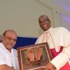 Rudolph Brown/PhotographerArchbishop of Kingston, Rev. Kenneth Richards, (right) presents award for 40 year of service to Rev. Msgr. Gregory Ramissoon, Founder of Mustard Seed at the Mustard Seed communities 40th anniversary awards and banquet at the St. Peter and Paul Church Hall on Saturday, September 8, 2018