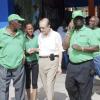 Collin Hamilton / Freelance Photographer

Former Prime Minister Edward Seaga (Second left) is being guided by JLP party supporters as he makes his way to the Tivoli Gardens High School in West Kingston to cast his ballot.