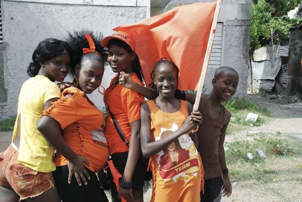 Collin Hamilton / Freelance Photographer

Young PNP party supporters in Trench Town pause for our cameras.