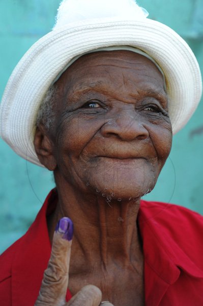 Norman Grindley/Chief Photographer
Ninety-year-old Hannah Barrows, proudly shows her finger after voting at the Seaward primary and Junior high St Andrew. December 29, 2011.