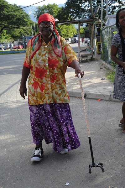 Norman Grindley/Chief Photographer
Seventy eight-year-old Victoria Kirkland, makes her way to a voting centre in Cassava piece December 29, 2011.