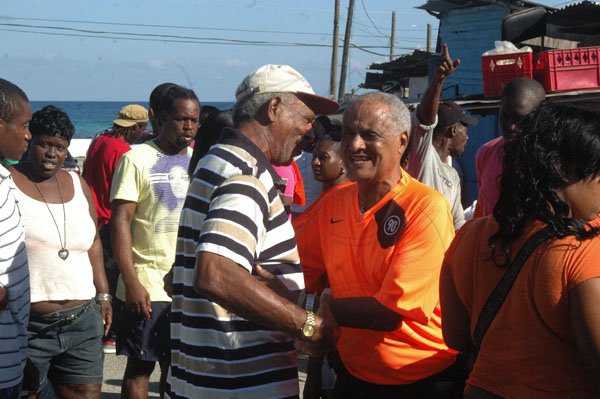Adrian Frater/Reporter
Election Day
Member of Parliament Dr. DK Duncan (centre) greets a party worker at the Sandy Bay Primary and Junior High School in the Eastern Hanover constituency yesterday. Dr. Duncan, the incumbent Member of Parliament, was challenged for the seat by Paul Kerr-Jarrett.