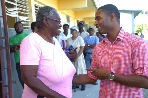 Marc Roye/Reporter
Election Day
PNP candidate for South West St. Elizabeth Hugh Buchanan greets senior citizen Marilyn Lalor during a visit to the Black River High School Polling Station.