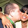 Jermaine Barnaby/Photographer
Audley Shaw plants a kiss on the cheek of Prime Minister Portia Simpson Miller as he greeted her following accepting the Order Of Distinction Commander on Heroes Day during a ceremony at Kings House on Monday October 21, 2013.
