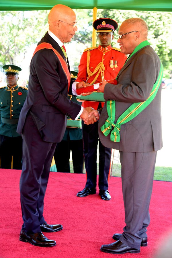 Lionel Rookwood/PhotographerProfessor Archibald Horace McDonald CD recieves The Order Of Jamaica from Governor General Sir Patrick Allen at The National Awards held at King's House on Monday October16,2017.
